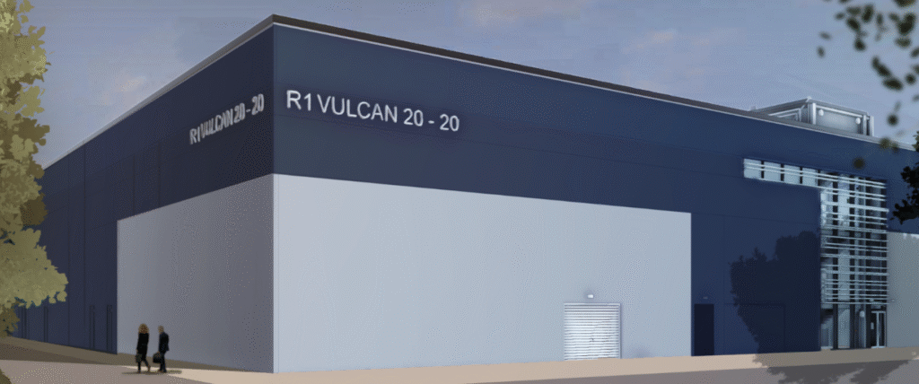Vulcan 20-20 building illustration: Large light grey and dark blue building with an entrance to one side.